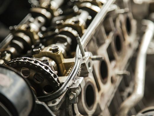 Close-up of an engine's valve train and timing chain. Stock photo.